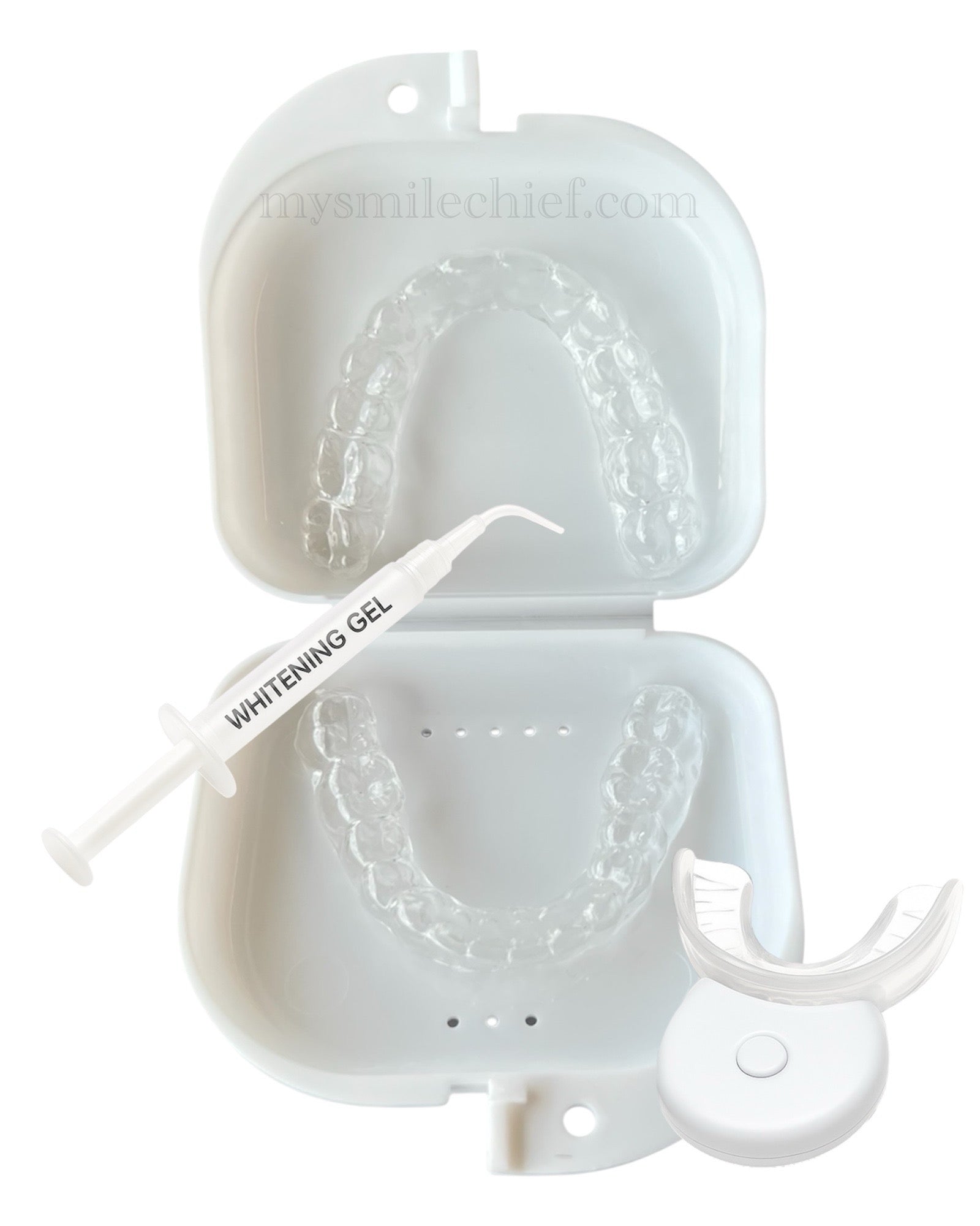 Custom upper and lower whitening trays in white box with whitening gel syringe and home LED whitening device.